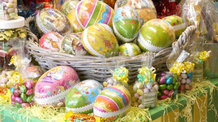 Colourful Easter themed image showing continental style Easter Eggs and seasonal chocolates and sweets