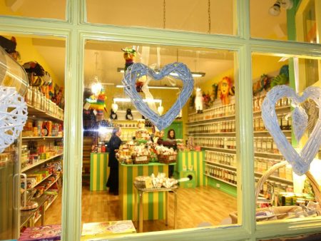 Photo taken at night showing the inside of DaffyDownDilly and some of the huge range of sweets!