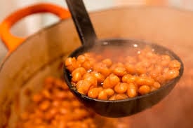 steaming baked beans in a scoop